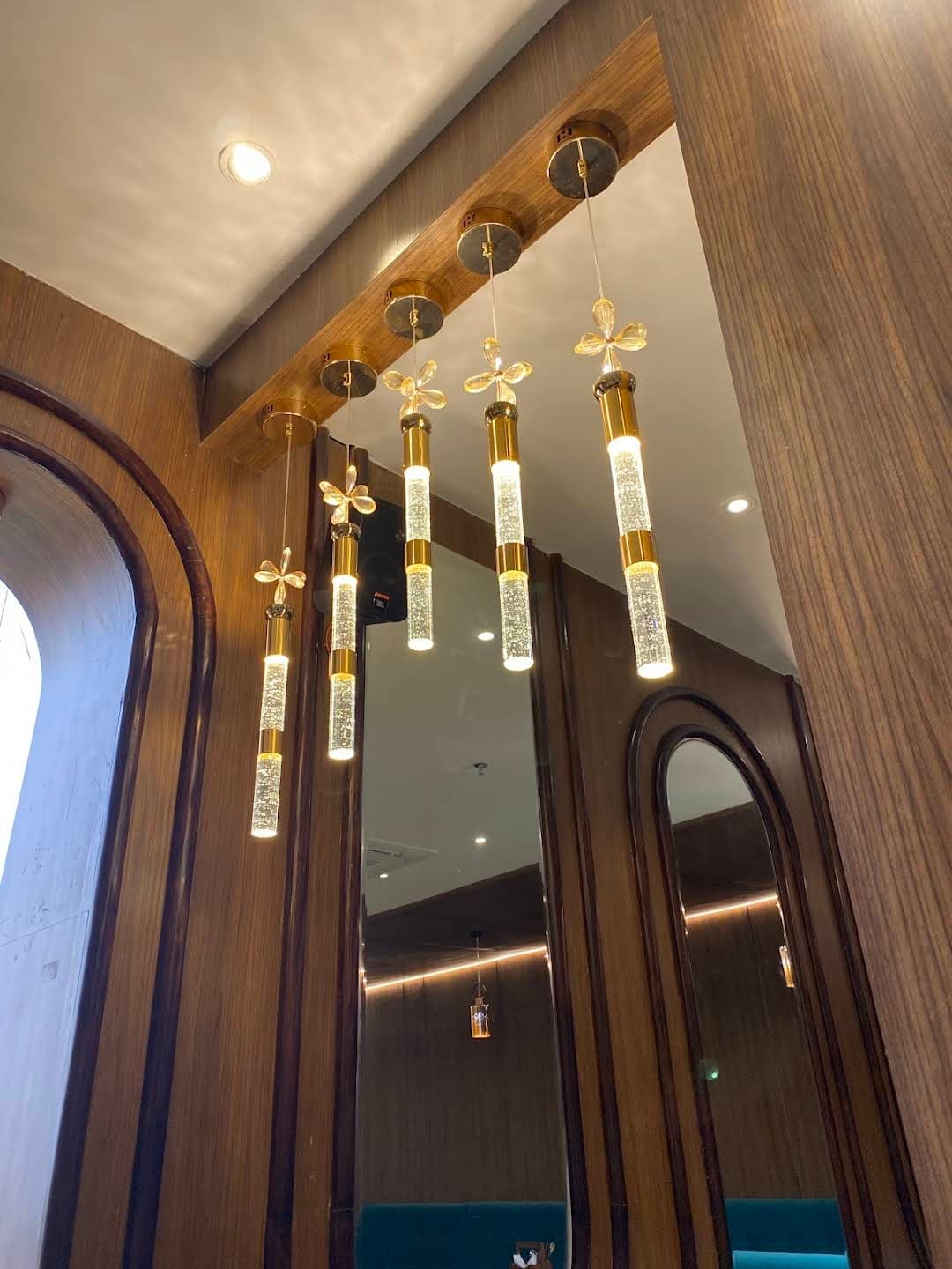 Luxury chandelier lighting illuminating the grand hotel interior